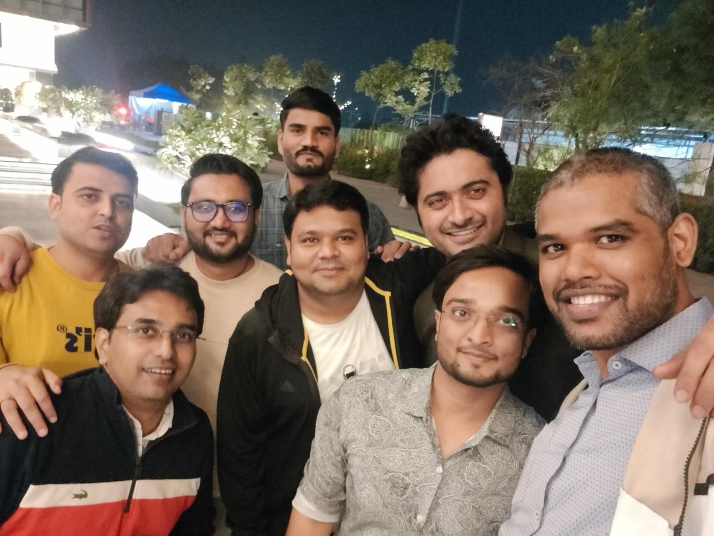Next Quarter team members together outdoors in the evening